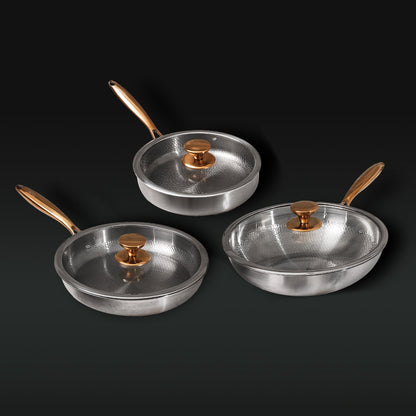 Set of three titanium frying pans with lids