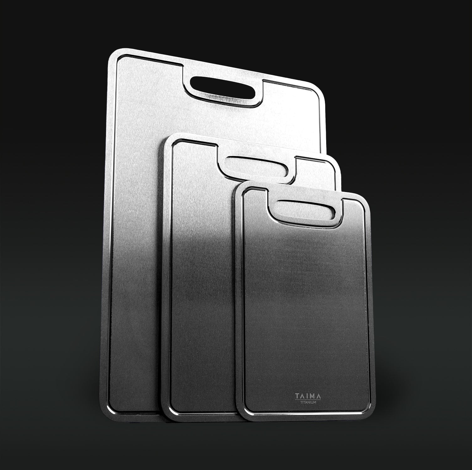 Three Titanium cutting boards with handles